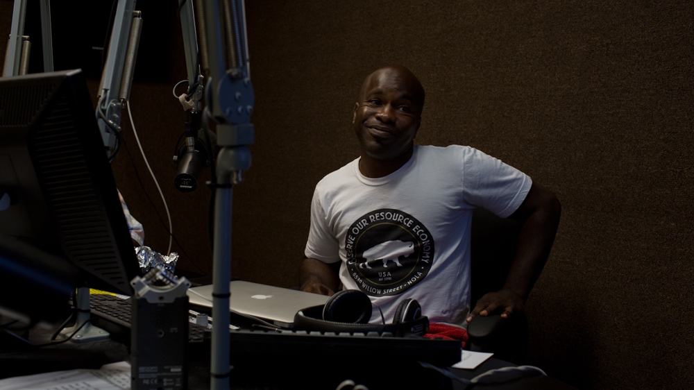 Tilman Hardy hosts his weekly radio show. Having attended two opposing demonstrations around the Robert E Lee monument the previous day, he focuses the discussion on the gulf in public opinion. 'There are a lot of folks who are for taking the monuments down. There are a lot of folks who are trying to keep them up. And there are a lot of folks who just don't care' [Roopa Gogineni]