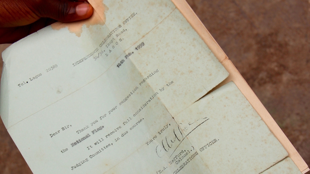 Michael Taiwo  Akinkunmi  still has the letter he received acknowledging his entry to the flag design competition [Femke van Zeijl/Al Jazeera]