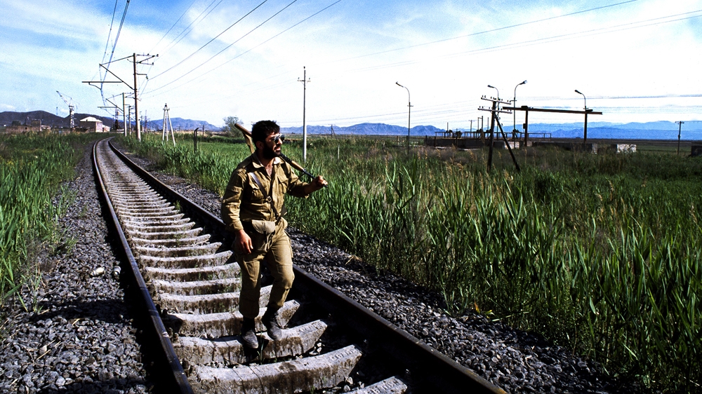 As I made my way to the frontline of the Nagorno-Karabakh War, I encountered this soldier returning from the front. I wondered if I would look as unaffected and blasé when I returned. 1992 [Jack Picone] 