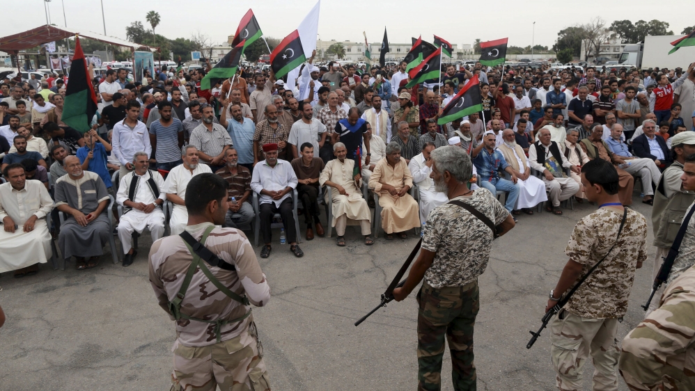 People take part in a protest against candidates for a national unity government proposed by U.N. envoy for Libya Bernardino Leon, in Benghazi
