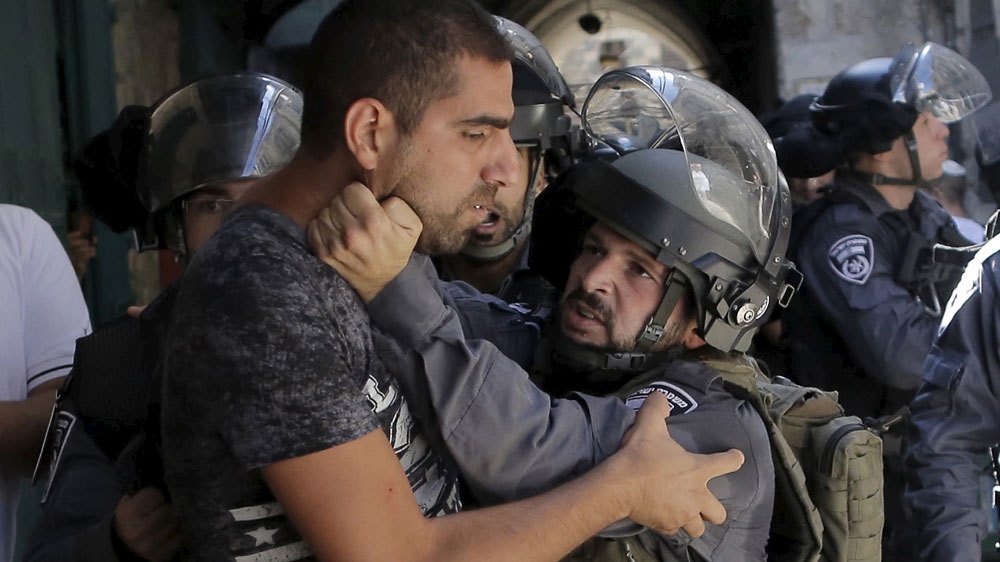 An Israeli policeman prevents a Palestinian man from entering the compound which houses al-Aqsa Mosque [Ammar Awad/Reuters]  Palestinian protesters throw stones during clashes in the West Bank city of Bethlehem [Abed Al Hashlamoun/EPA]  A Palestinian man prays as Israeli policemen stand nearby during Friday prayers outside Jerusalem's Old City near the Arab East Jerusalem neighbourhood of Wadi al-Joz [Ammar Awad/Reuters]  