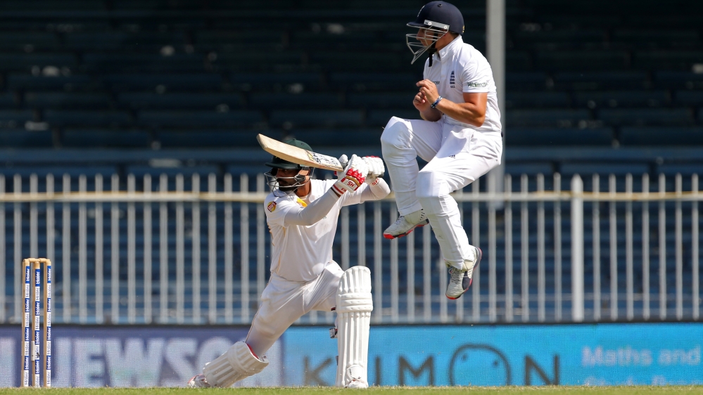 Pakistan''s Mohammad Hafeez in action with England''s James Taylor (R)