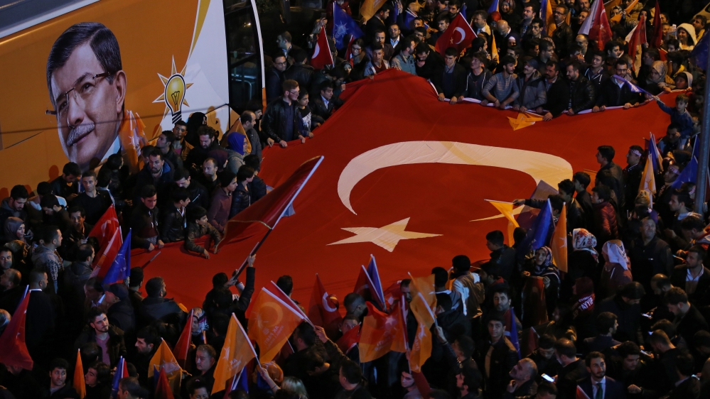 AK party supporters gather to celebrate the election result in Istanbul on Sunday night [AP]