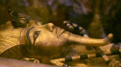 One of Egypt's famed King Tutankhamun's golden sarcophagus is displayed at his tomb in a glass case at the Valley of the Kings in Luxor, Egypt [AP]