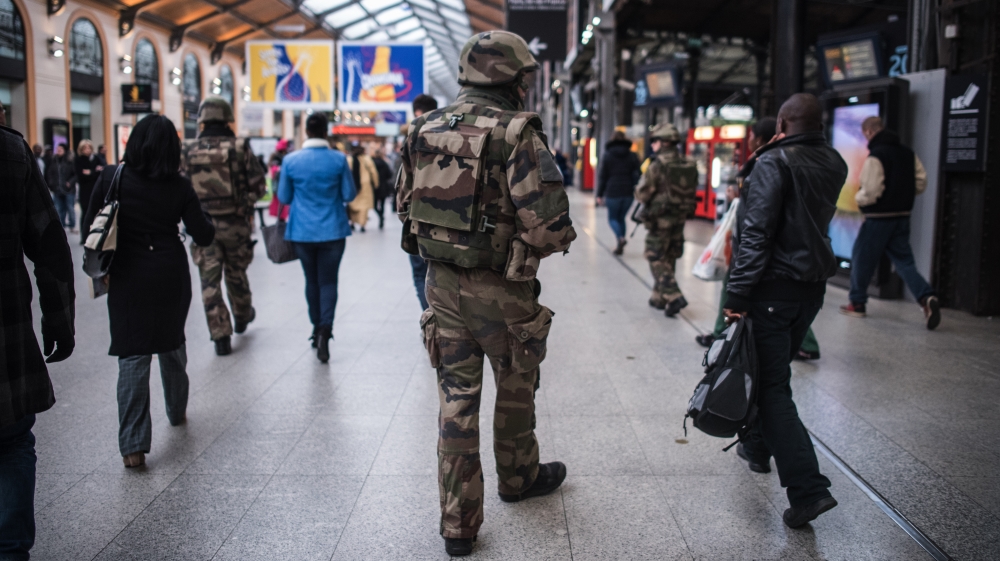 A French soldier patrols at Gare Saint Lazare train station in Paris on Saturday [Kamil Zihnioglu/AP]
