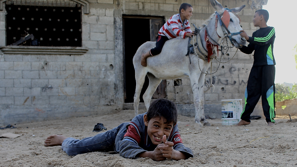 Wissam pretends to be a soldier and, for a moment, he feels in control [Matthew Vickery/Al Jazeera]