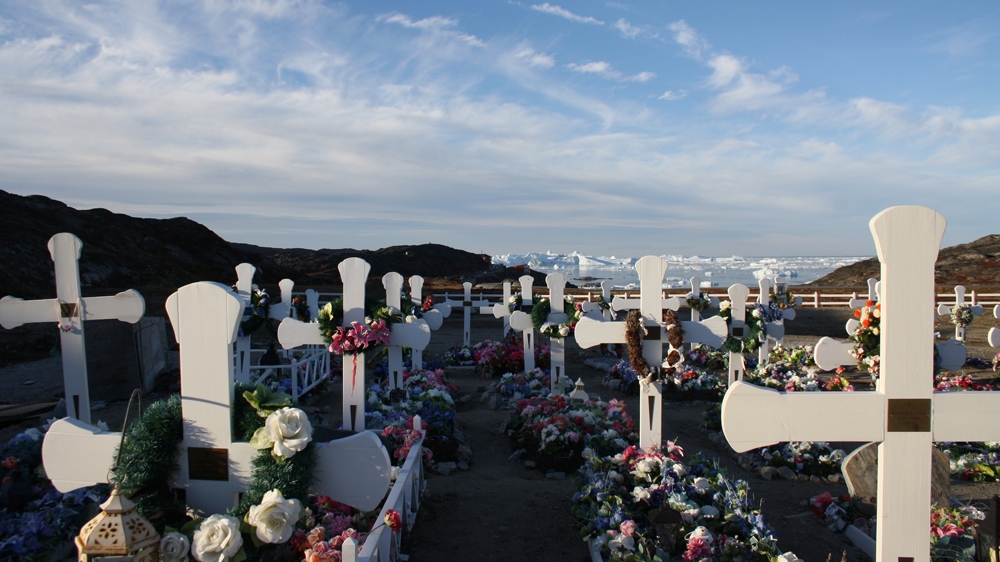 Ilulissat cemetery lies in the mountains just outside town [Lene Bech Sillesen/Al Jazeera]
