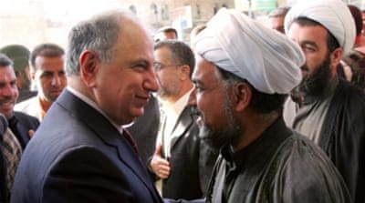 Ahmed Chalabi meets a Shia leader upon arrival at a political rally on December 8, 2005, in Baghdad [Getty]