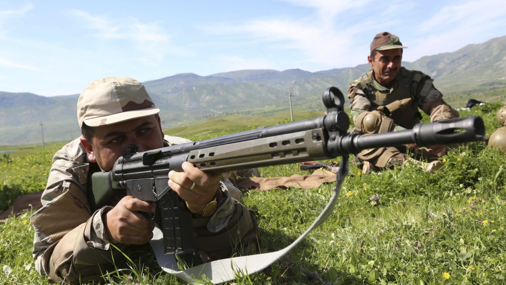 Member of Kurdish peshmerga forces holds a rifle during a training session at a training camp on the outskirts of Dohuk province