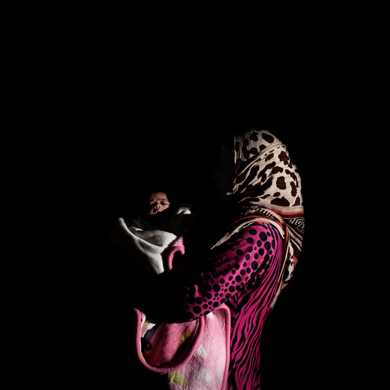 Twenty-eight-year-old Ghazzieh is from Idlib and has been in Lebanon for four months. She has seven children. Her youngest, Sham, is 40 days old. Sham had to stay in an incubator for five days. So far, they have only been able to pay for half of the hospital expenses. The hospital has retained her ID until she pays the remainder  [Felipe Jacome/Al Jazeera]   