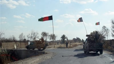Afghan security forces patrol the Nad Ali district of Helmand province, on December 22 [AP]