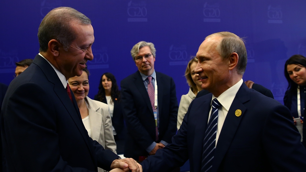 Erdogan shakes hands with Putin at the end of the G-20 Summit in Antalya, Turkey, on November 16 [AP]