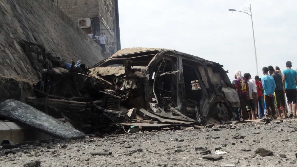 People gather at the site of the a car bomb attack that killed the governor of Yemen''s southern port city of Aden