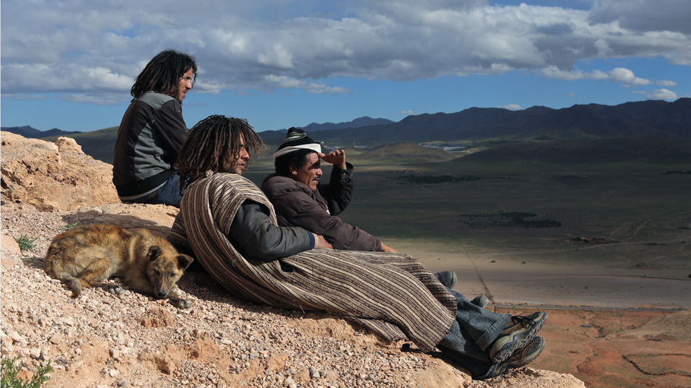 After a demonstration, activists relax on top of Mount Alebban [Nadir Bouhmouch/Al Jazeera]