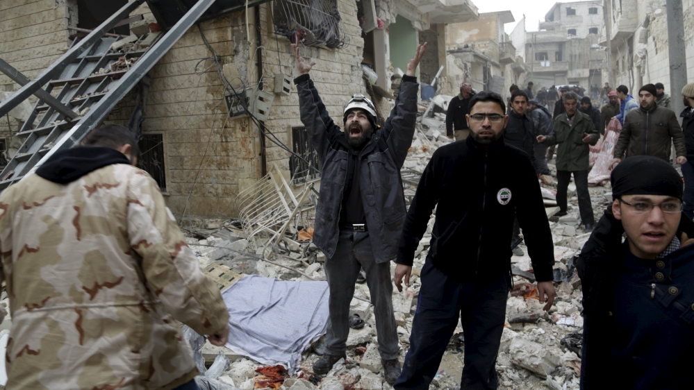 A civil defence member reacts at a site hit by what activists said were three consecutive air strikes carried out by the Russian air force [Khalil Ashawi/Reuters]