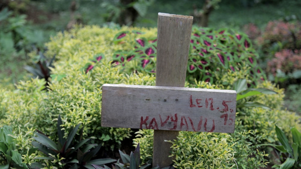 Wooden crosses mark the graves of those killed in the attack on the district of Kalongo, in Beni territory, North Kivu, in May 2015 [Zahra Moloo/Al Jazeera] 