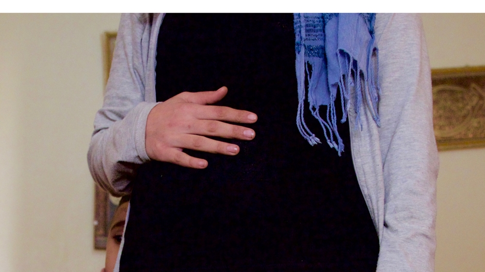 Jenan is six months pregnant with her fourth child, but is worried about how she will be able to keep a roof over their heads [Priyanka Gupta/Al Jazeera]