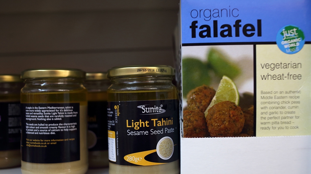 An aisle in the Vircis' shop featuring ingredients for Syrian cooking. The owners of the store hope it will make the island's new arrivals feel at home [Harrison Reid/Al Jazeera]