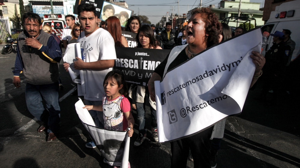 Some in Mexico greeted Pope Francis with banners of disappeared relatives, asking for prayers and blessings [Felix Marquez/AP]