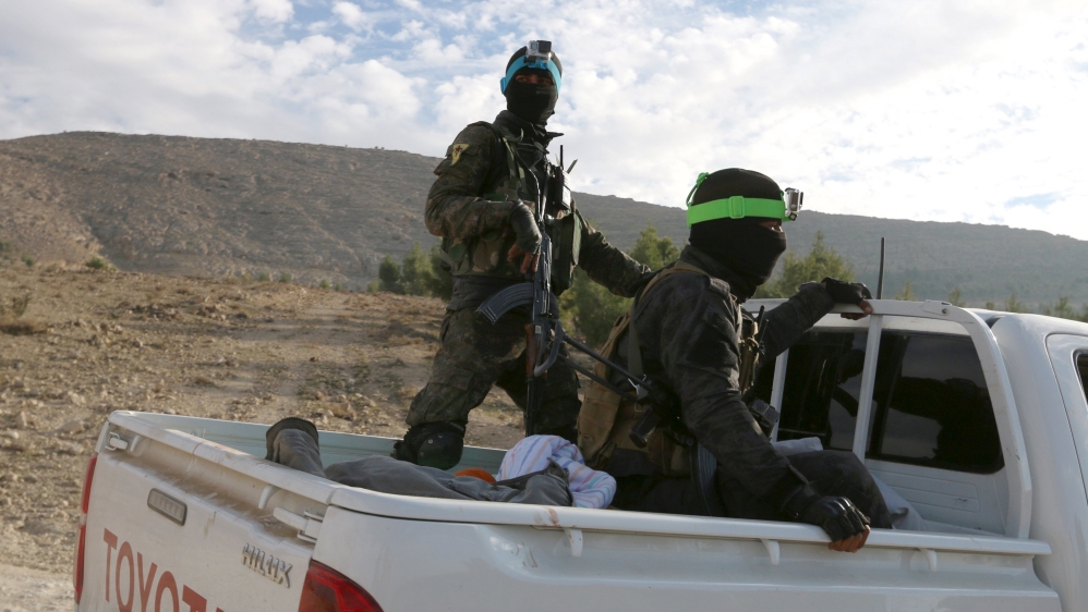 YPG fighters ride on a pick-up truck during what they said was an offensive against ISIL to take control of Tishrin dam, south of Kobane, Syria [REUTERS]
