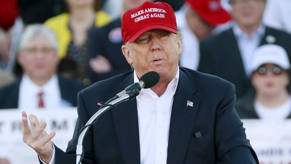 U.S. Republican presidential candidate Donald Trump speaks to supporters at a rally at Madison City Schools Stadium in Madison