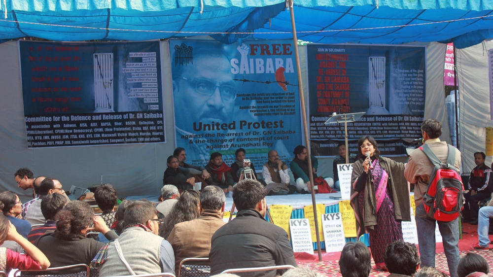 Protesters rally in New Delhi calling for the release of a 49-year-old professor who is paralysed from the waist down and being held in prison pending trial [Sanjay Kumar/Al Jazeera] 