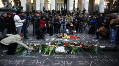 People leave tributes at the Place de la Bourse in Brussels following the attacks [Getty]