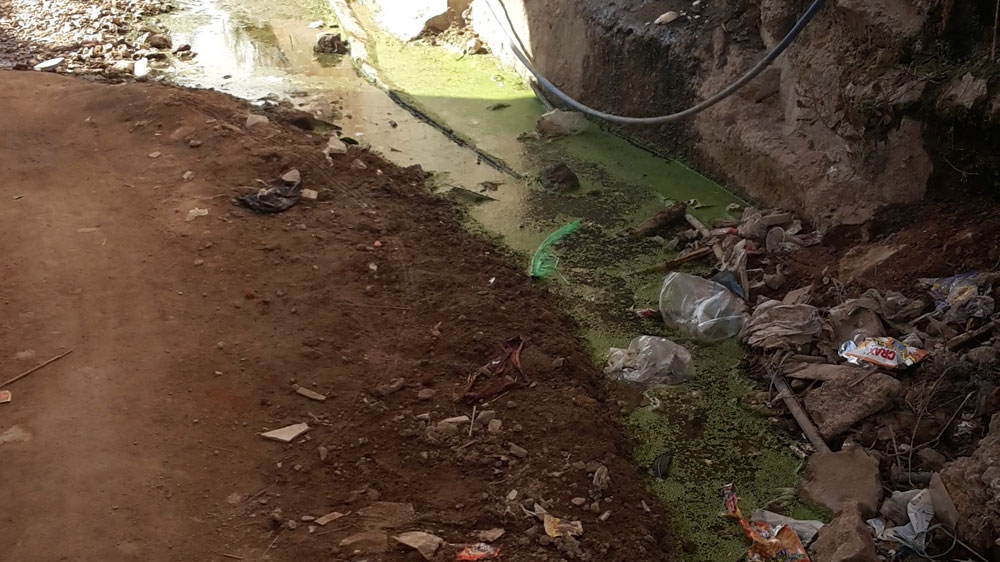 The pathway to a slum school in Hyderabad, India [Mohd Abdul Alam/Al Jazeera]