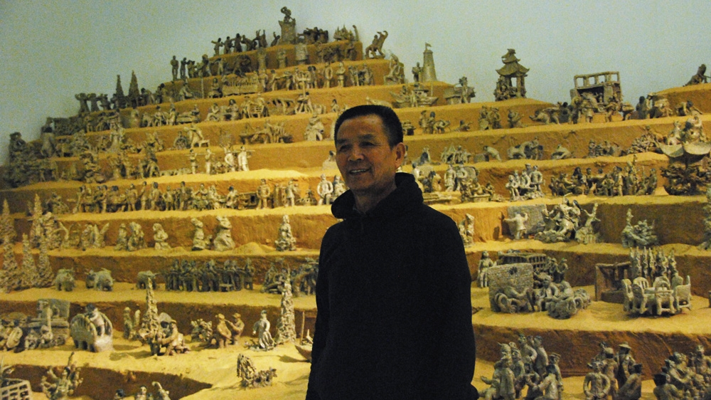 Artist Hu Zhijun has molded about 600 clay sculptures for the What About the Art? Contemporary Art from China exhibition [Anna Nigmatulina/Al Jazeera]