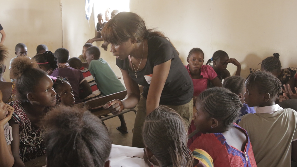 Sister Fa, a Senegalese rapper, has been conducting workshops with children, parents, local rappers and the wider community to raise awareness about children's rights - especially for girls - and the dangers of cutting. [FatmaNaib/Al Jazeera]