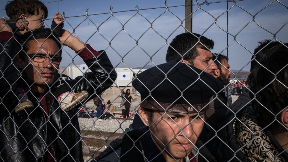 Afghan refugees on the railway tracks at Idomeni [Nicola Zolin/Al Jazeera] 