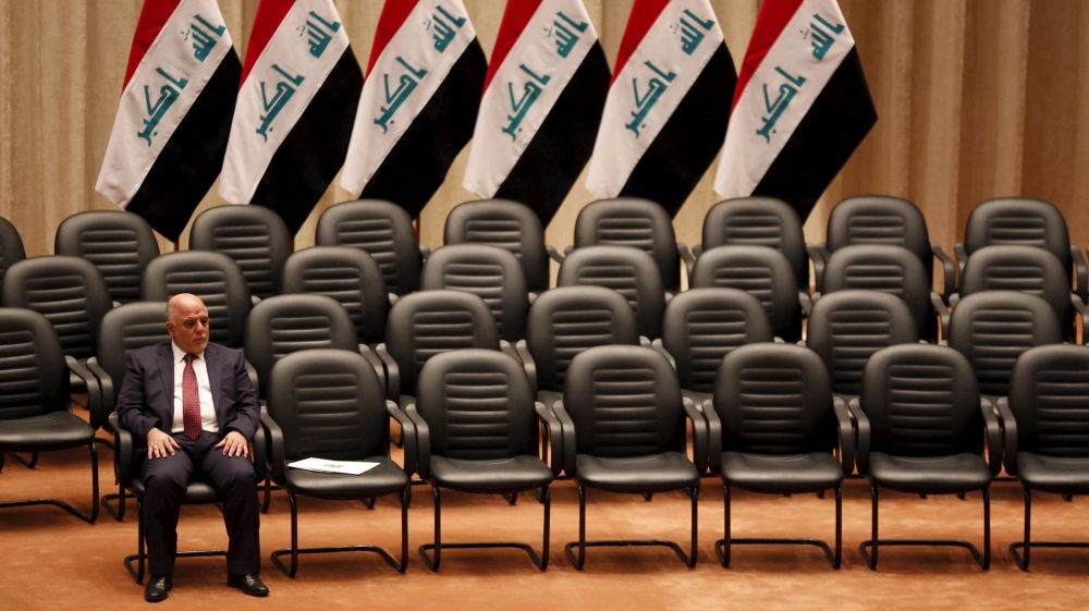 File photo of Iraq''s new premier Haider al-Abadi sitting during a parliamentary session to vote on Iraq''s new government at the parliament headquarters in Baghdad