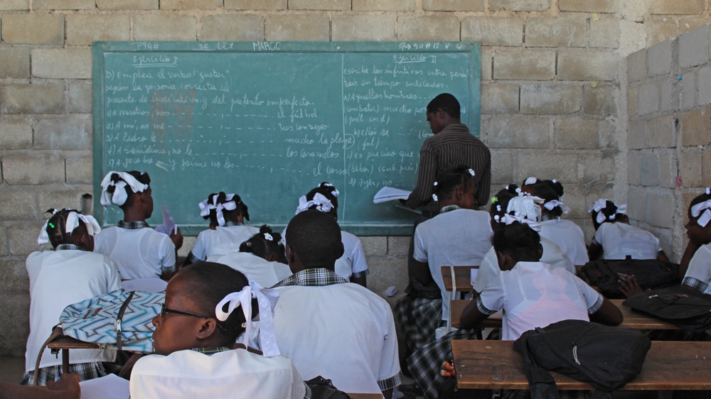 Children study Spanish at the Institute Mixte Christal. It is being expanded through financial contributions from parents [Stephanie Ott/Al Jazeera] 