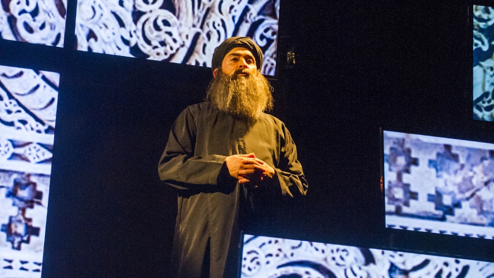 The play gives an explanation of ISIL's goals through the words of Abu Bakr al-Baghdadi, played by Nabil Elouahabi [Tristram Kenton/Courtesy of the London National Theatre]