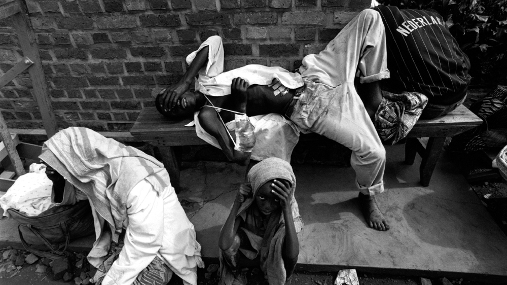 Deeply traumatised Tutsi casualties at the Red Cross hospital in Byumba, north of Kigali, take stock of the enormity of what they have experienced [Jack Picone/Al Jazeera]