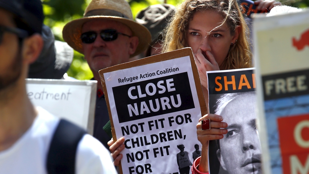 File picture of a protester holding a placard during a rally in support of refugees in central Sydney, Australia