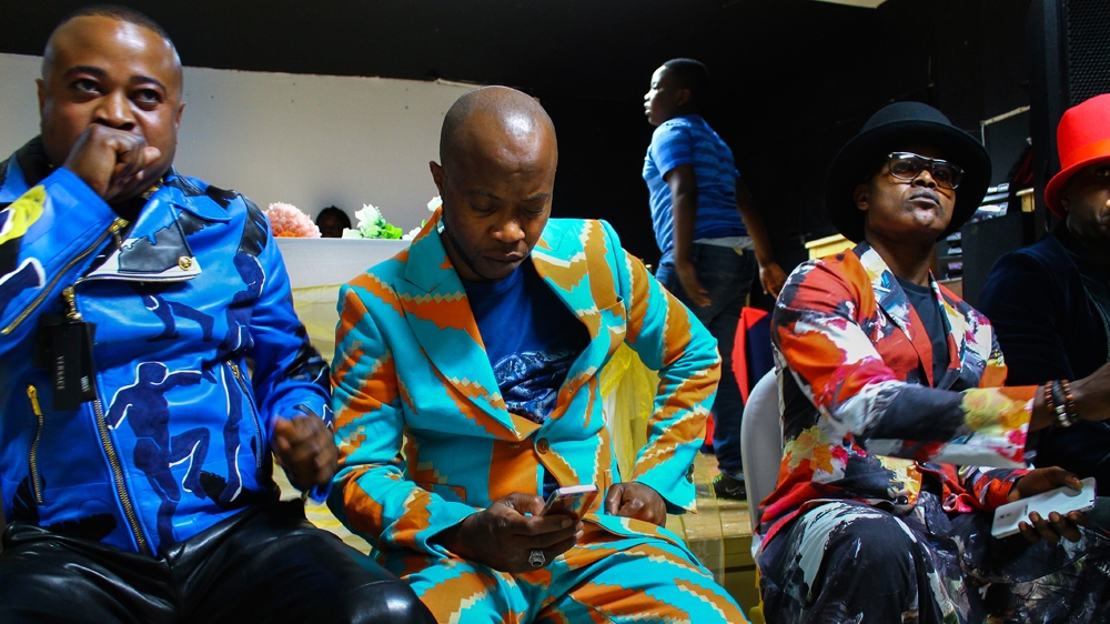 A sapeur leaves the tag on his jacket for all to see [Eugenio Giorgianni/Al Jazeera]