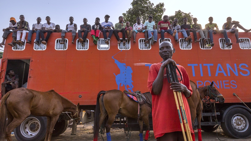 Spectators watch a match [Andrew Esiebo/Al Jazeera]  