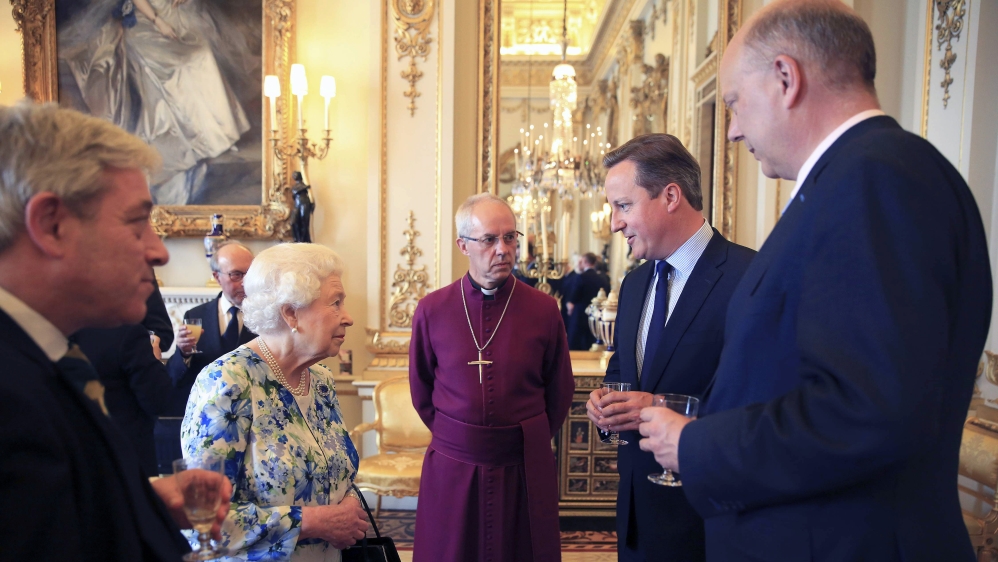 Britain''s Prime Minister David Cameron speaks with Queen Elizabeth