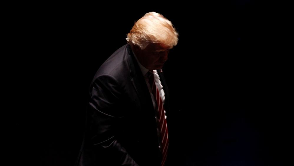 Republican presidential candidate Trump heads off stage after addressing an audience in Atlanta