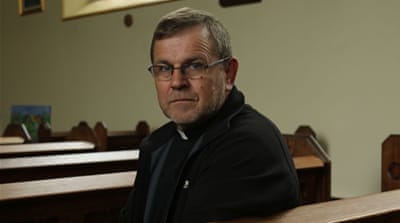Father Stanislaw Kowalski, chaplain to the Polish community in Boston, hopes the community finds peace [Philip Kleinfeld/Al Jazeera]
