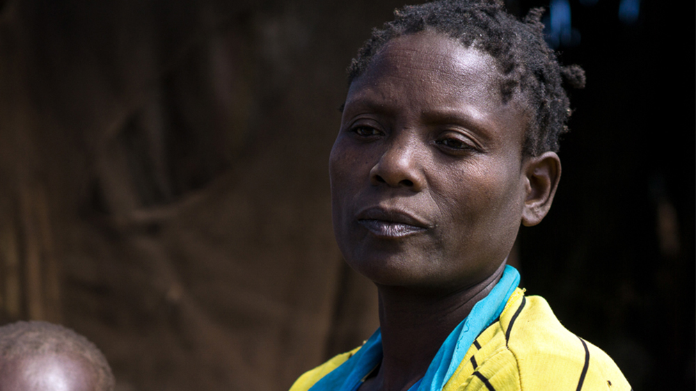 Loucy Bato says that she has a strong urge to return home, and does not wish to move to the Luwani camp. 'I don't want to be disconnected from my home.' [Sorin Furcoi/Al Jazeera]