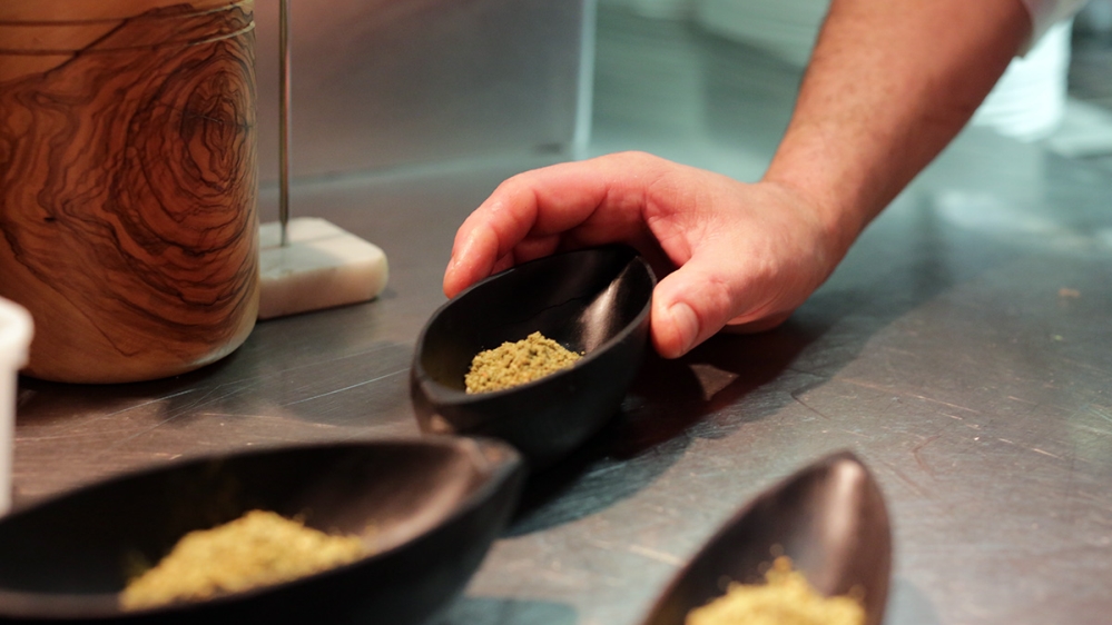 Za'atar  ,  a     mix of thyme and other spices well-known in Syria and Lebanon, made it on to the tables of L'Ami Jean in Paris [Micah Garen/Al Jazeera]