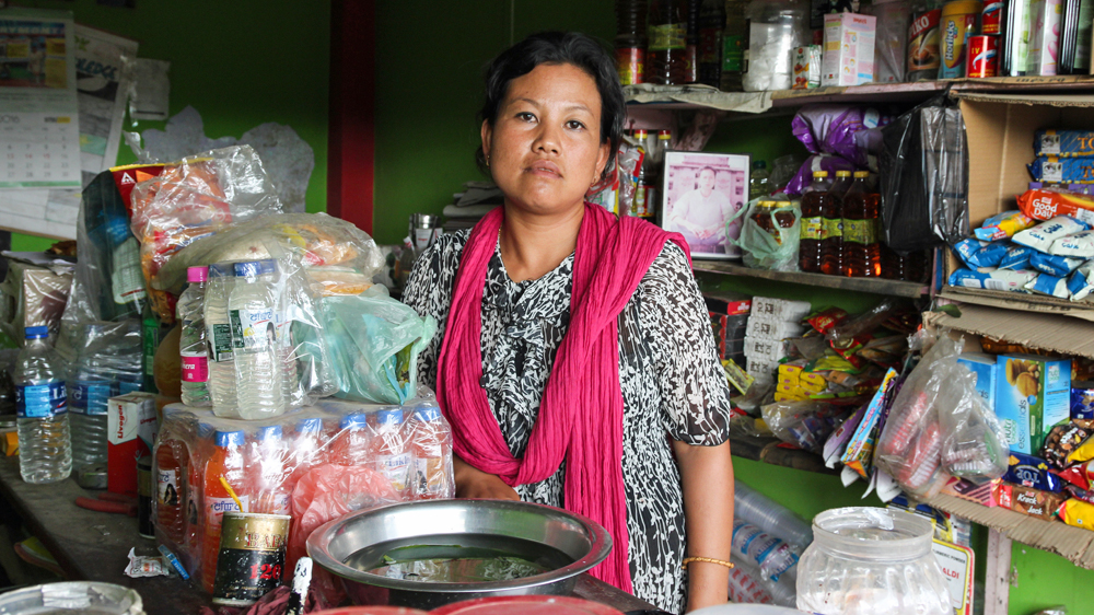 Yaikhom Edina was paralysed on her left side after her husband died in 2009. She's recovered and opened a small store [Neha Tara Mehta/Al Jazeera]