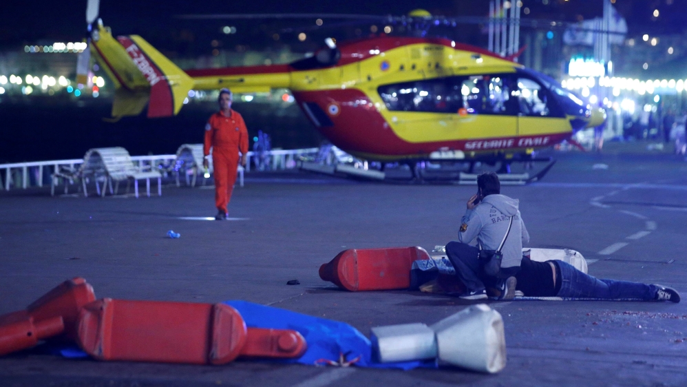 An injured individual is seen on the ground after the deadly attack in Nice, France, when a truck ran into a crowd [Eric Gaillard/Reuters]