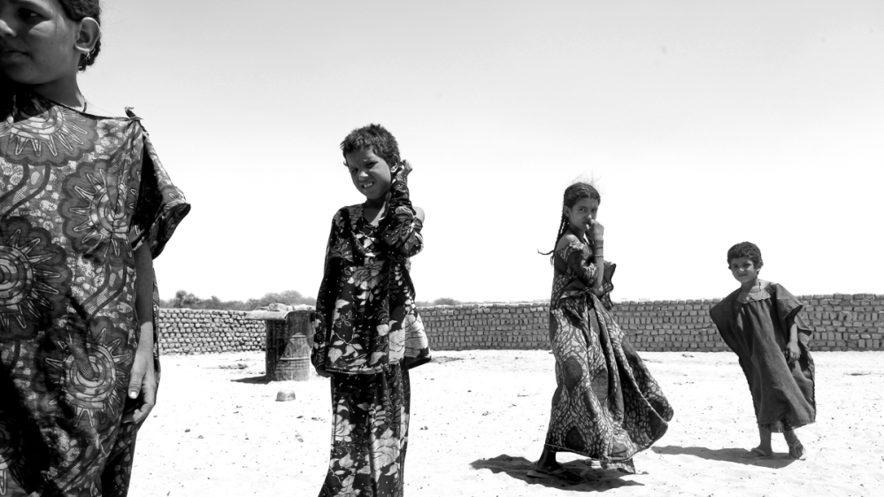 While the men from the Dousack tribe meet with the peacekeepers, the women and girls come out to talk to the two female journalists [ Marielle van Uitert/Al Jazeera]