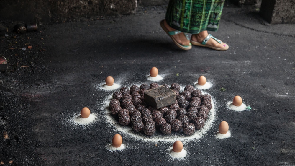 Many ceremonies take place throughout the day at the shine to San Simon. Each is for a specific purpose and involves specific items [Gabriela Campos/Al Jazeera]
