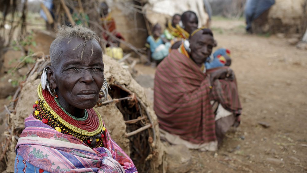 Turkana women sit in a village near Baragoy. Turkana men herd cattle, sheep and goats. Livestock is at the centre of life in Turkana life [Goran Tomasevic/Reuters] 