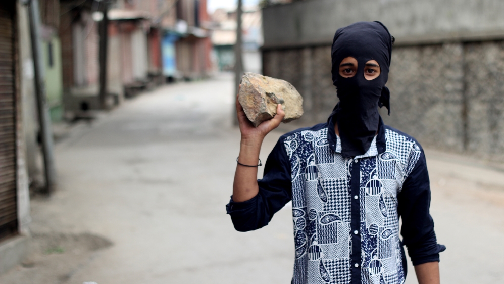 Nineteen-year-old university student and protester Umer, who was throwing rocks at security forces in Nowhatta, downtown Srinagar [Aarabu Ahmad Sultan/Al Jazeera]