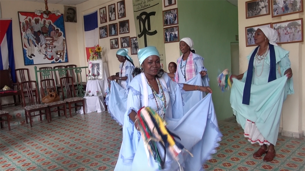  The costumes of the Cuban dance known as tumba frances   evoke the elegant ballgowns of bygone Haiti [Sylvia Hines/Al Jazeera]